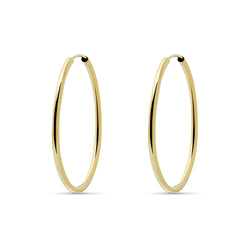 This 14 karat gold hoop earring measures 38mm and is one of our favorite essentials. Despite their size, these earrings are very comfortable and light. 