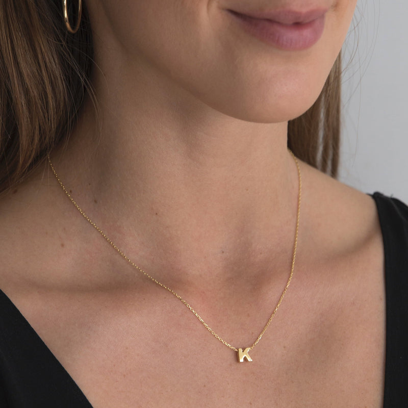 A 18 karat gold vermeil necklace with your initial letter "K". This diamond letter necklace is a special jewelry necklace that can be worn day and night. A genuine diamond stone in the corner of the letter makes this gold diamond necklace a luxury and ideal gift for yourself, your best friend or loved one. 