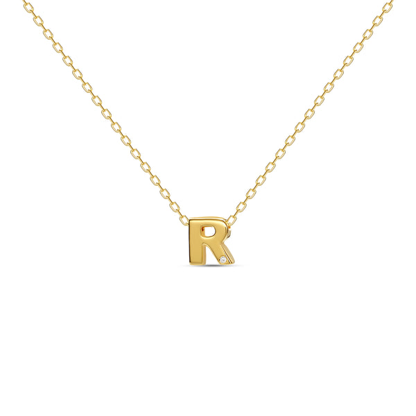 A 18 karat gold vermeil necklace with your initial letter "R". This diamond letter necklace is a special jewelry necklace that can be worn day and night. A genuine diamond stone in the corner of the letter makes this gold diamond necklace a luxury and ideal gift for yourself, your best friend or loved one. 