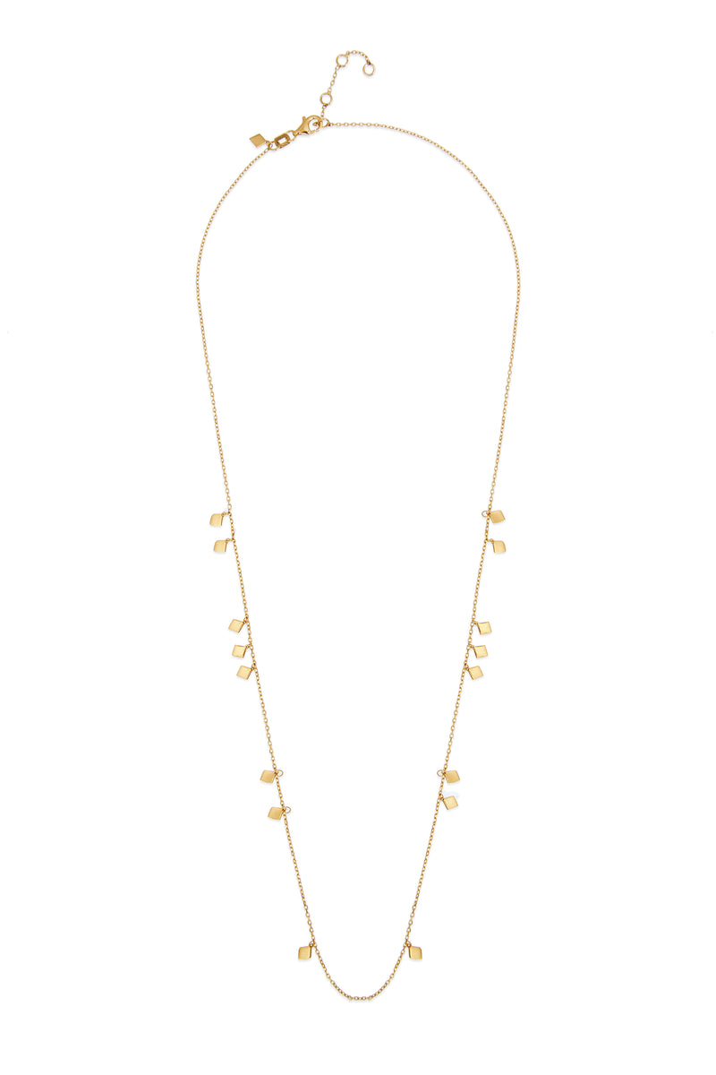This delicate and playful 14 karat gold necklace features dangling tribal gold charms. Its simple style mixes and matches easily with other jewels and is the perfect accessory for a layering look.